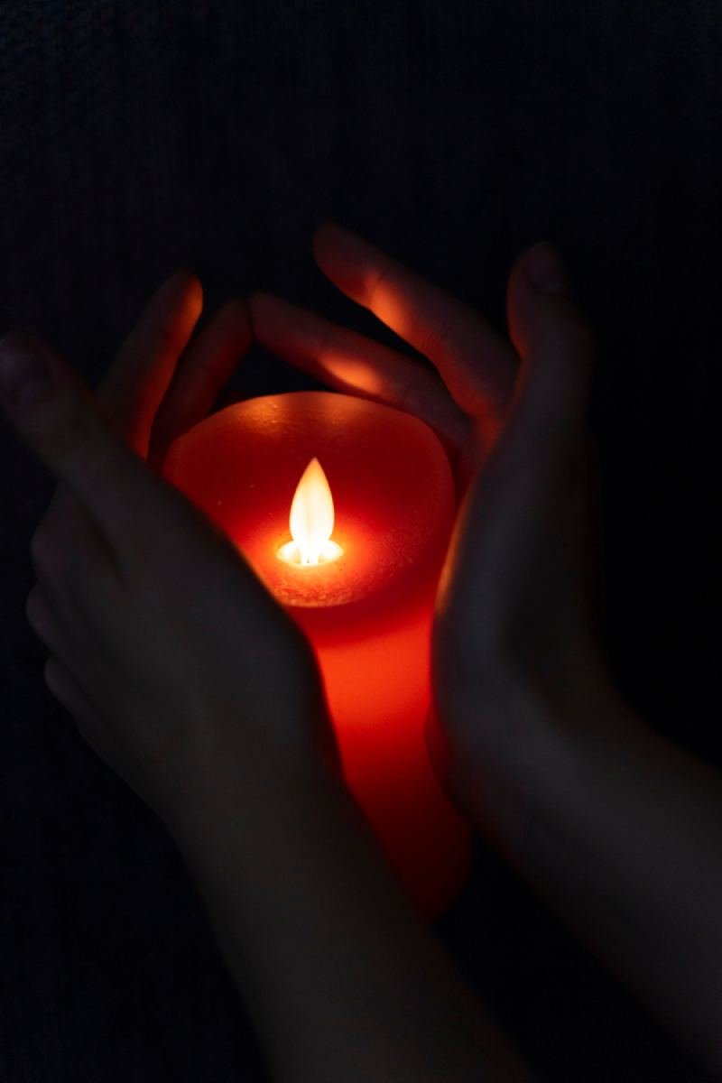 hands-holding-candle-light